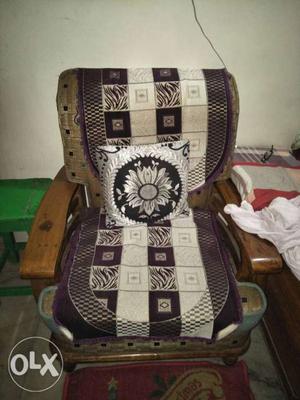 Brown Wooden Framed Brown And Black Padded Floral Armchair