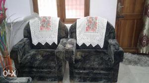 Two Brown And Gray Floral Sofa Chairs