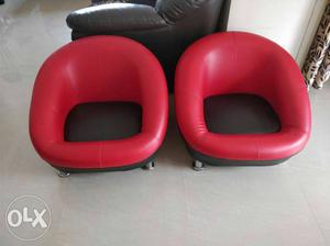 Two Red And Black Leather Padded Chairs