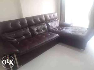Wine color leather sofa in mint condition just 9