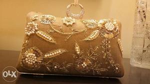 Brand new evening clutch with embroidery and