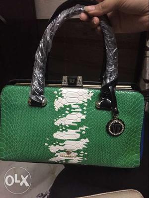 Branded unused handbag,, minor deffect on handbelt