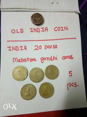 Five Round Gold-colored 20 Indian Paise Coins