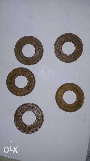 Five Round Gold-colored Indian Pice Coins