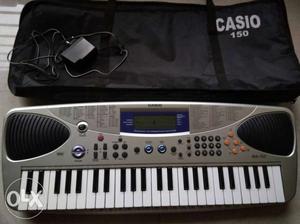 Grey And White Casio Electronic Keyboard.UNUSED PERFECT