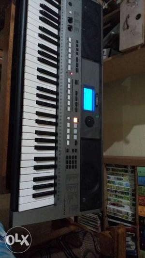Grey And White Electronic Keyboard