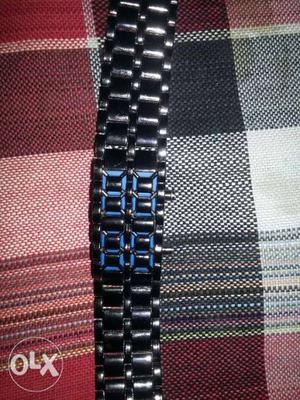 It is a digital watch with blue led