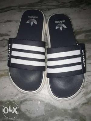 Pair Of Black-and-white Adidas Slide Sandals