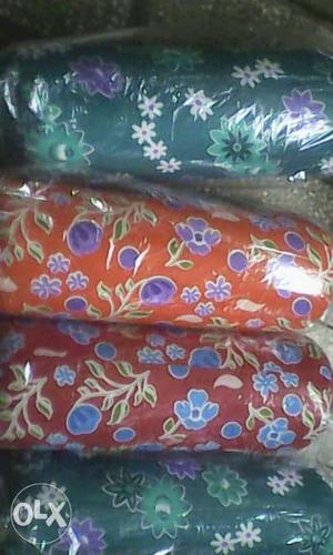 Red, Blue, And White Floral Textile