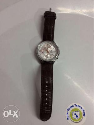 Round Silver Chronograph Watch With Black Leather Strap