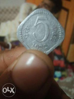 Silver-colored 5 India Paise Coin