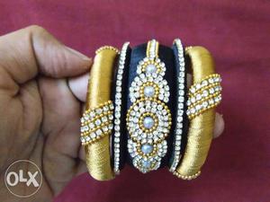 Three Brown And Black Thread Bangles