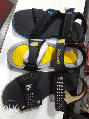 Three Unpaired Black And Yellow Sandals