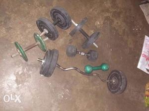 Two Black Dumbbells And Black Barbell