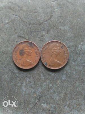 Two Round Gold-colored Elizabeth Coins