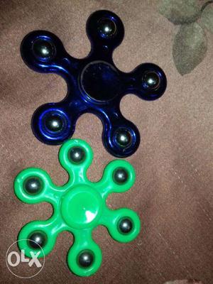 Two fidget spinner the colour is blue and green