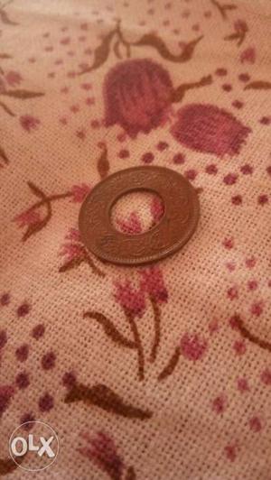 An old 1 paisa coin in 's