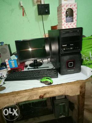 Black Computer Monitor, Tower, Keyboard, And Mouse