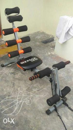 Black, Orange, And Gray Six Pack Exercise Equipment