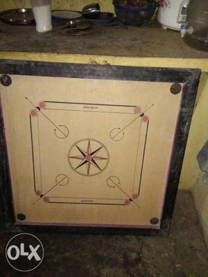 Brown And Black Carrom Board