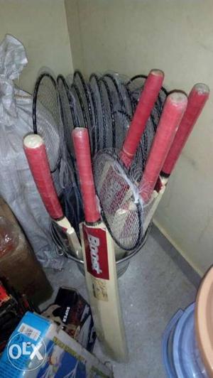 Brown And Red Cricket Bats And Badminton Rackets
