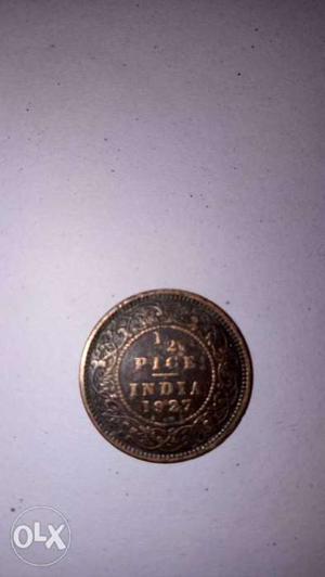 Round Bronze-colored Indian Pice Coin