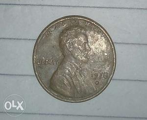 Round  Silver-colored Lincoln Penny