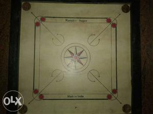 White, Red, And Black Carrom Board
