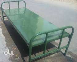 Steel cot with bed for sale