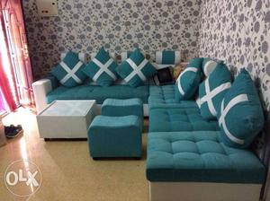 Tufted Teal And White Corner Sofa With Throw Pillows