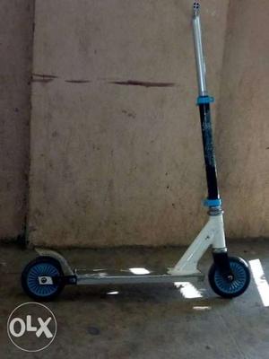 White, Black, And Blue Kick Scooter