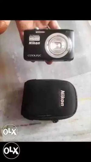 Black Nikon Coolpix Camera With Case