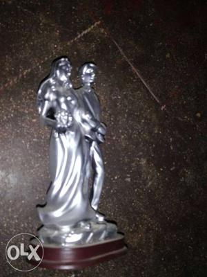 Man And Woman Holding Their Hands Together Figurine