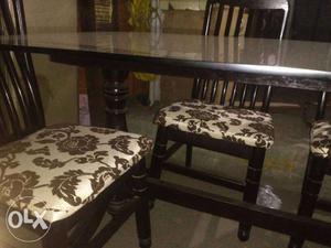 Two Brown Wooden Fabric Padded Armless Dining Chairs
