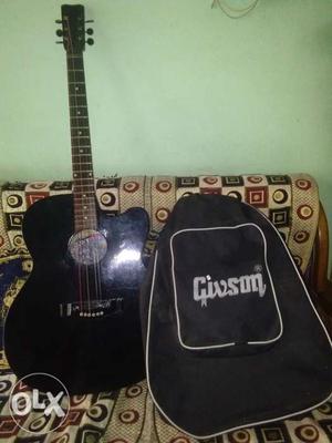 1 year old Givson jumbo body acoustic guitar with