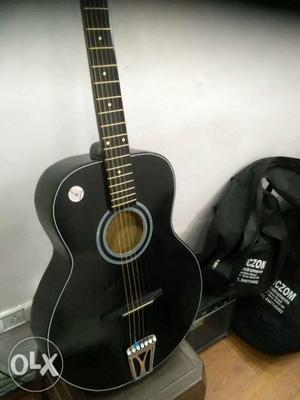 Black hollow acoustic guitar for sale, very easy