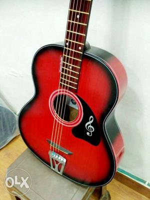 Red and black pure acoustic guitar, best in