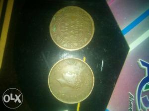 Two Round Gold-colored Indian Anna Coins