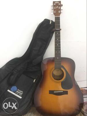 Yamaha F310 Dreadnought Acoustic Guitar with guitar bag.