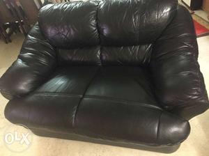 Black leather sofa. 3 +2 + 2 seater. Made of