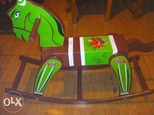 Green, Red, And Yellow wooden rocking horse