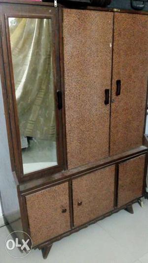 Small wooden cupboard with mirror