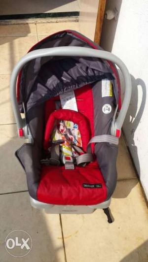 Baby's Red And Grey Car Seat and stroller