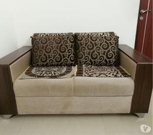 Comfortable 3+2 sofa with cushions and sofa with broad armre