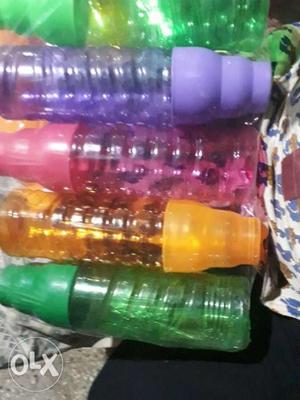 Purple, Pink, Yellow, And Green Plastic Bottles