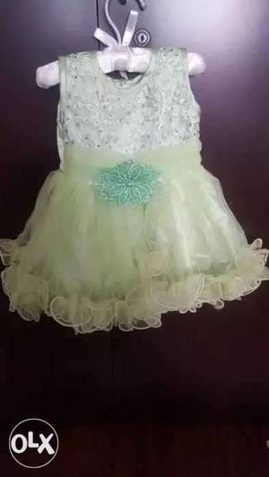 Sleeveless green frock 6 to 9 months