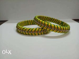 Two Green-and-yellow Silk Thread Bangles With Clear