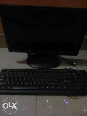 Black Computer Monitor, Keyboard, And Mouse