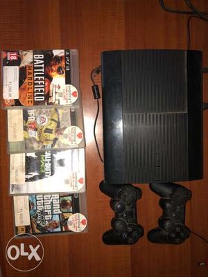 Black Sony PS3 Console With 2 Controllers And 4 Game