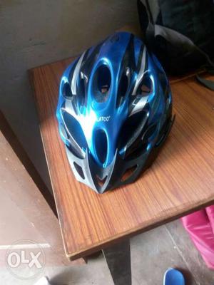 Blue, Gray, And Black Bicycle Helmet